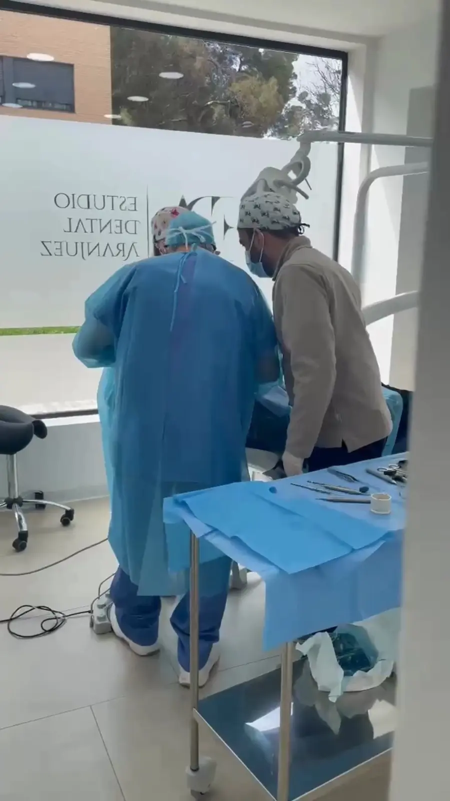 A frame of the course reel: clinicians operating on a patient